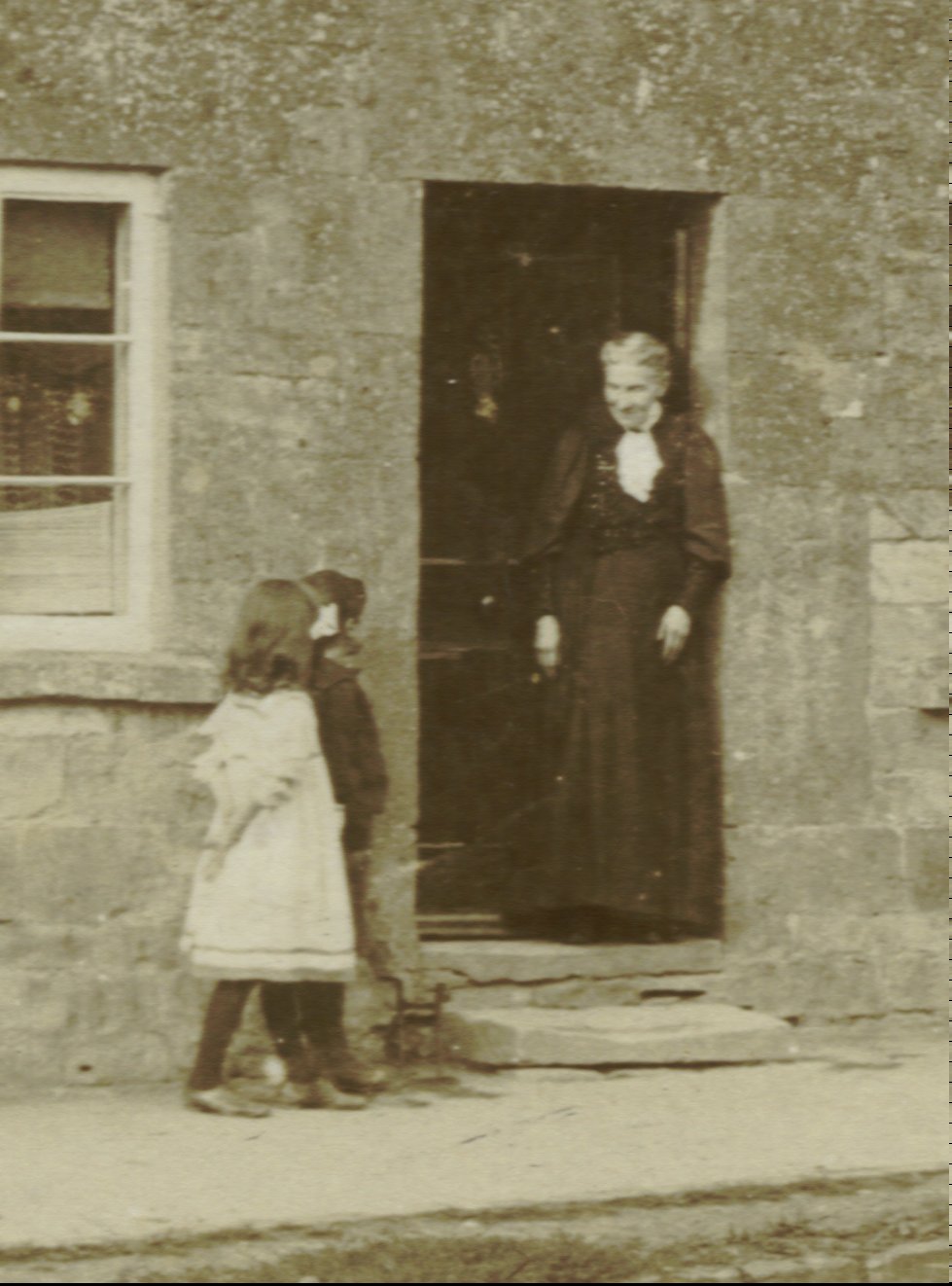 Rebecca Ann (DAY) STOKES with her grandchildren Ralph and Dolly EDWARDS in about 1906